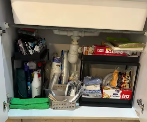 Pull out organiser in a bathroom cupboard