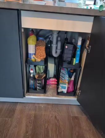 Pull out organiser fitted in a kitchen cupboard